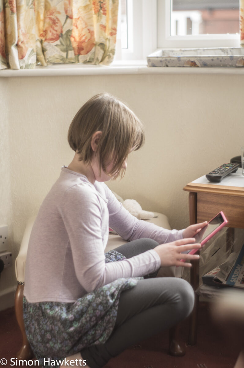 Sony Nex 6 test shots - A young girl playing with a tablet