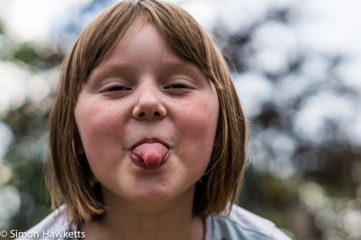 Garden pictures with Takumar standard lenses - A girl with a cheeky expression
