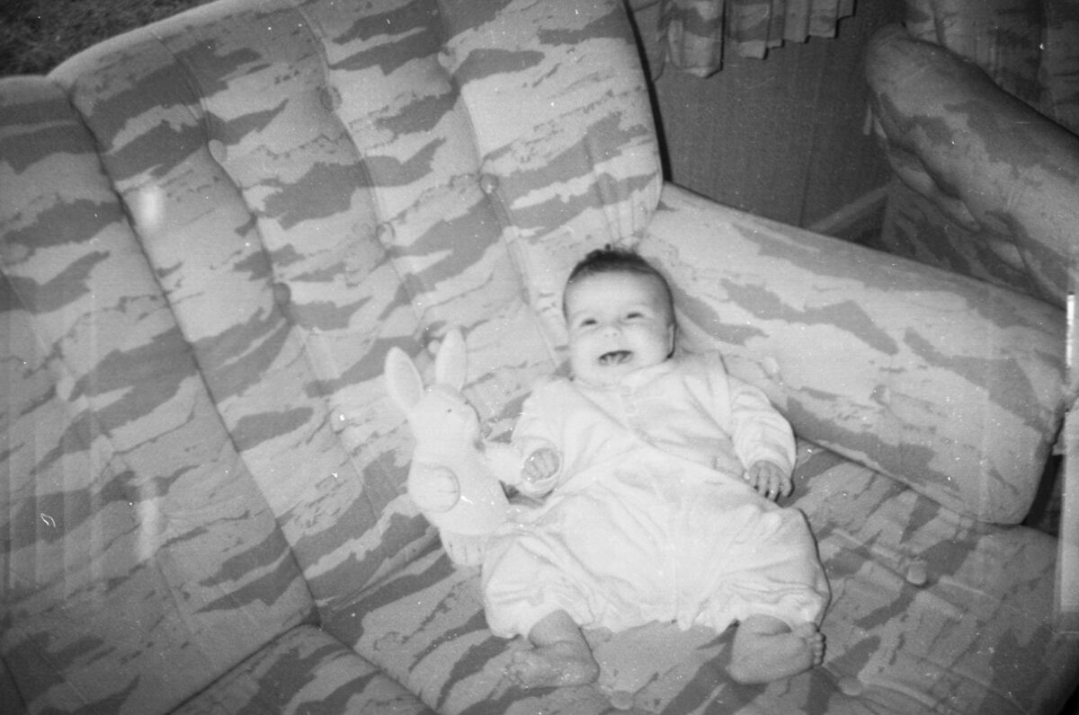 Photos from film found in old cameras - A baby with a toy on a sofa