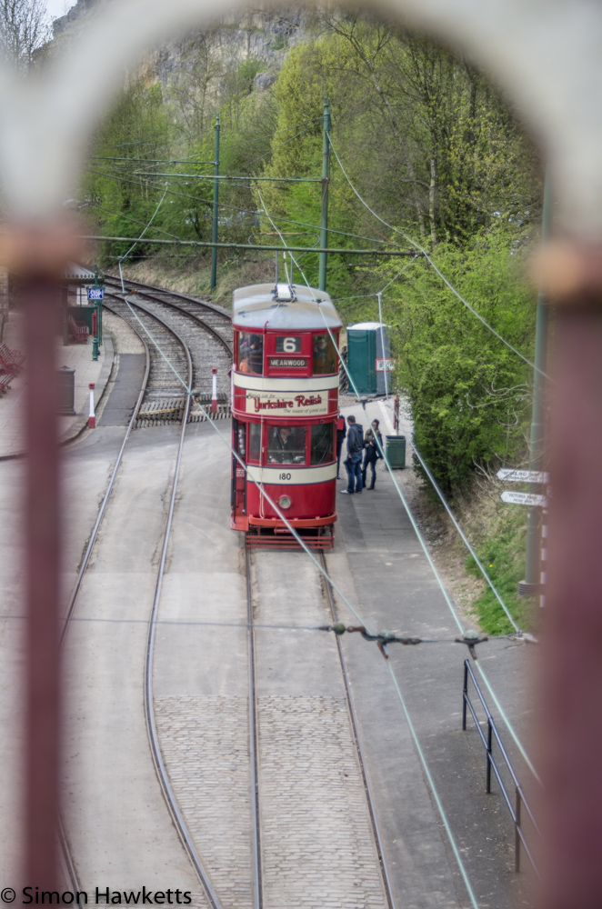 Crich tramway museum - tram viewed through railings