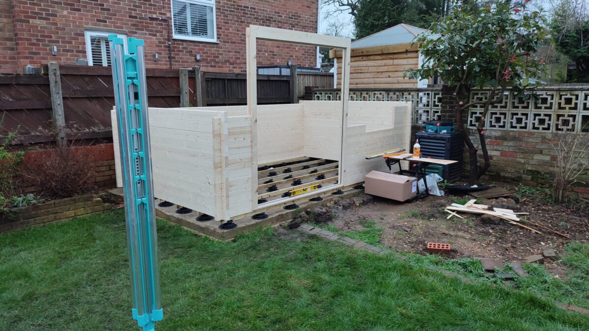 A picture of a partially assembled Dunster House log cabin