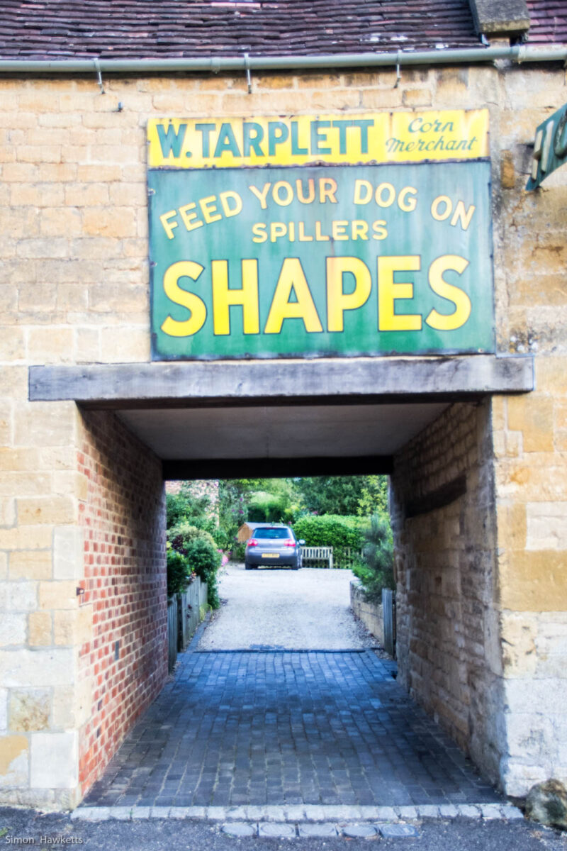 An advertising sigh on a cotswold stone cottage