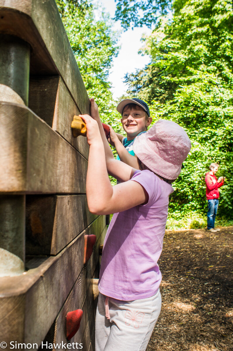 Pictures from Sudbury Hall in Derbyshire - A small girl and boy play on a climbing wall