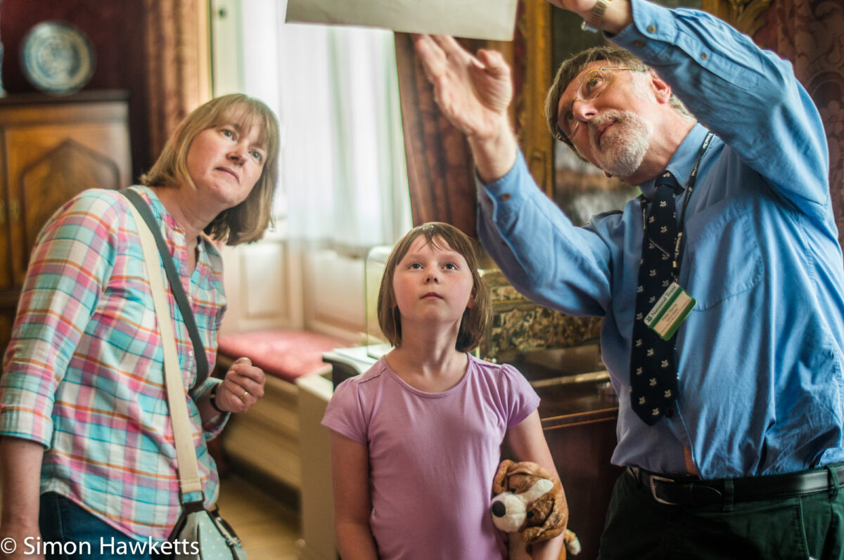 Pictures from Sudbury Hall in Derbyshire - A small girl and her Mum in conversation with a guide