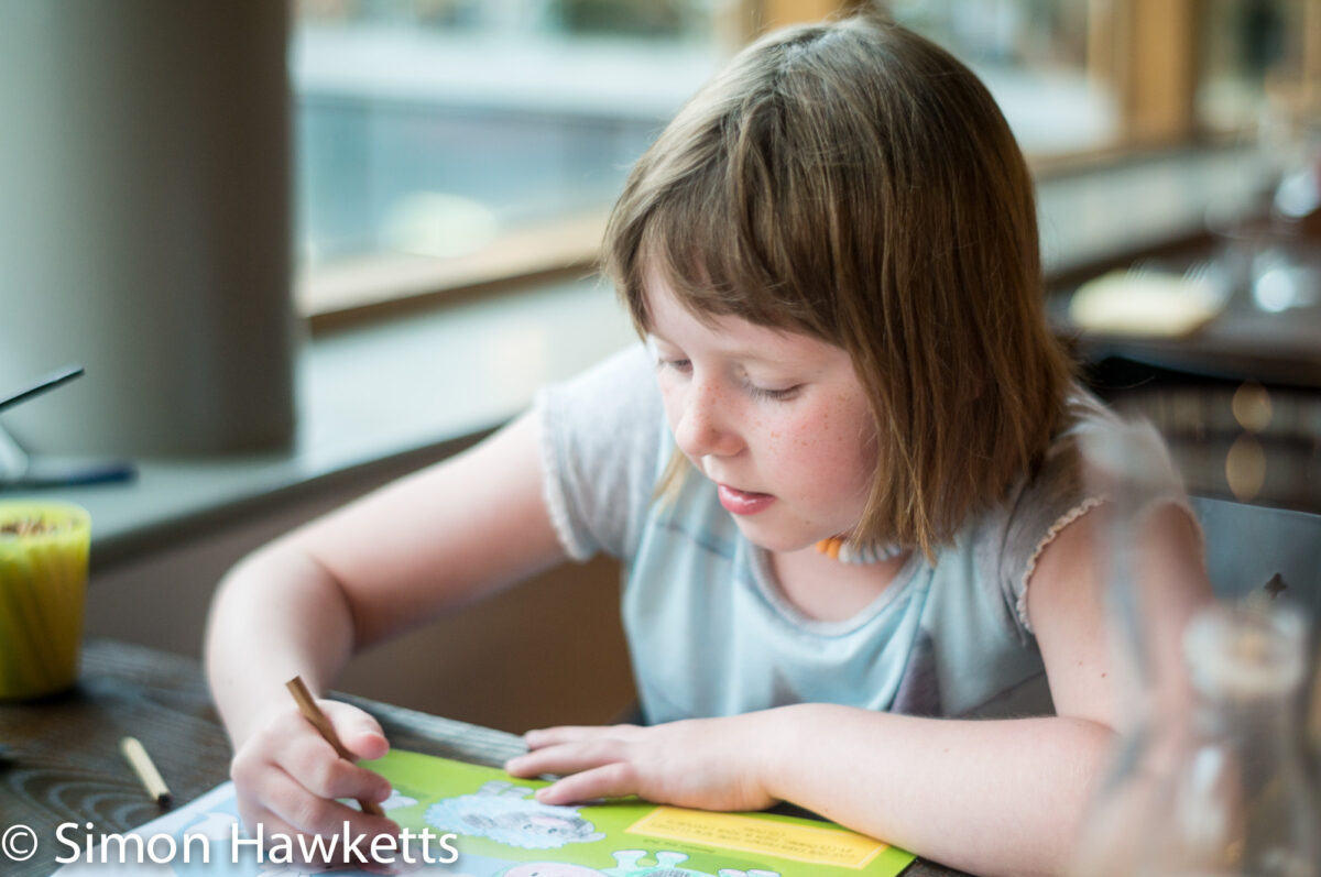 Pictures from Woburn Forest CenterParcs - A girl drawing at the dinner table
