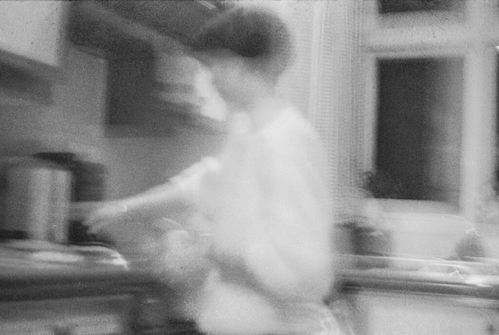 Photos from film found in old cameras - A woman at a cooker