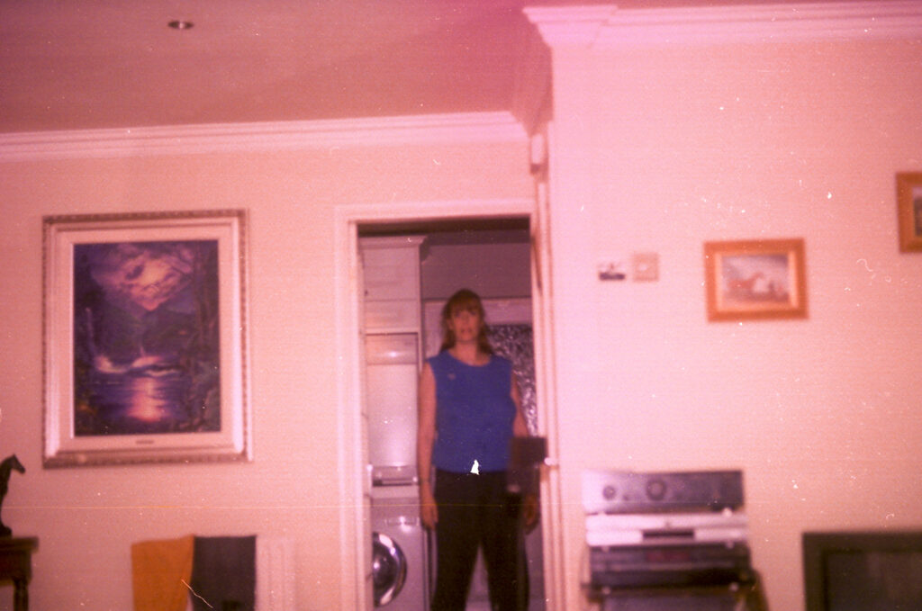 Photos from film found in old cameras - A woman standing in an interior doorway