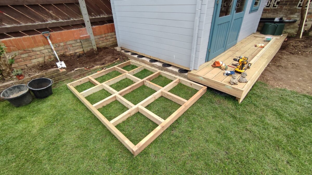 Picture of a wooden base ready for construction of a garden room extension storage shed.
