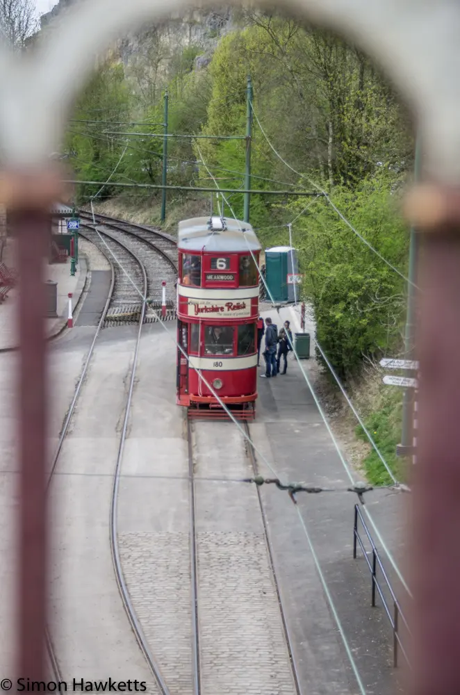 Crich tramway museum - tram viewed through railings