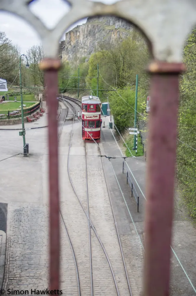Crich tramway museum - tram viewed through railings