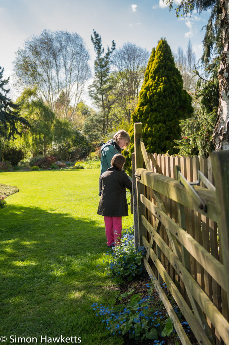 Foggy bottom gardens pictures - A woman and girl stand by the gate at foggy bottom