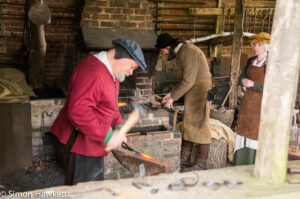 The blacksmith in the forge at Kentwell hall in Suffolk