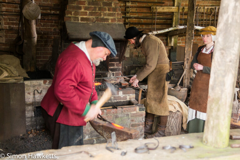 The blacksmith in the forge at Kentwell hall in Suffolk