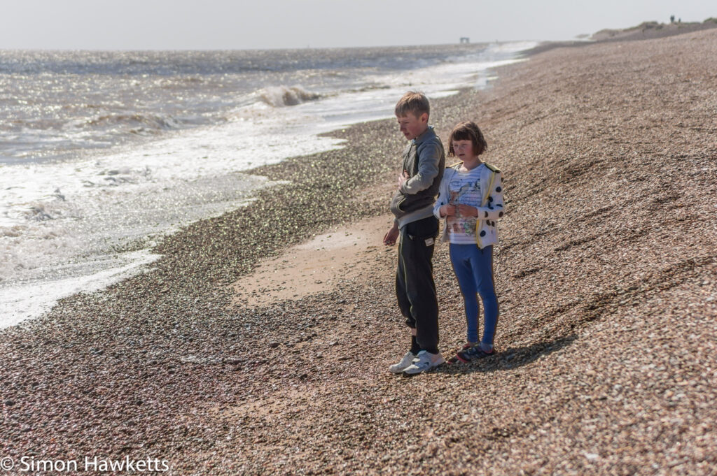 Dunwich Heath Suffolk pictures - Two children standing on the shoreline