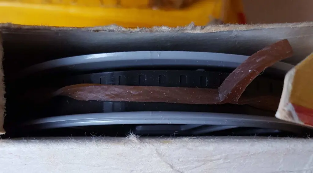 A collection of 8 mm home movies 7 8mm Home Movies - Film held by old rubber band