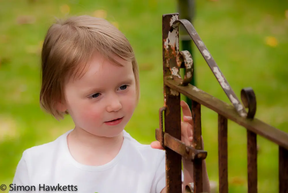 Portrait - Emma examines a gate 2 Emma examines the gate in Nanny's garden
