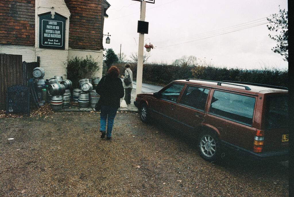 Photos from film found in old cameras - people arriving at a pub
