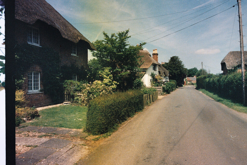 Photos from film found in old cameras - a village lane with a thatched cottage