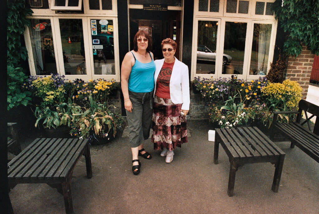 Photos from film found in old cameras - two women outside a pub