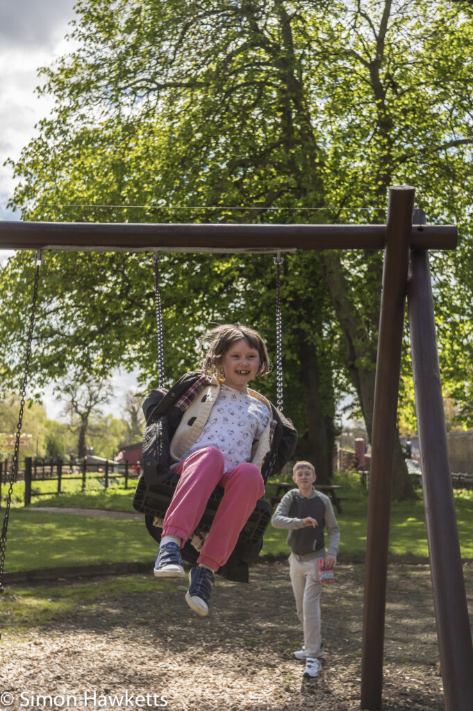 Pictures from Bressingham gardens in Norfolk - Girl caught at the top of a swing