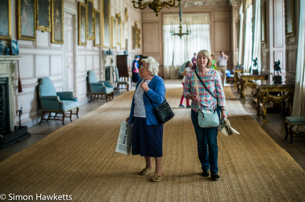 Pictures from Sudbury Hall in Derbyshire - Two people walk through the gallery