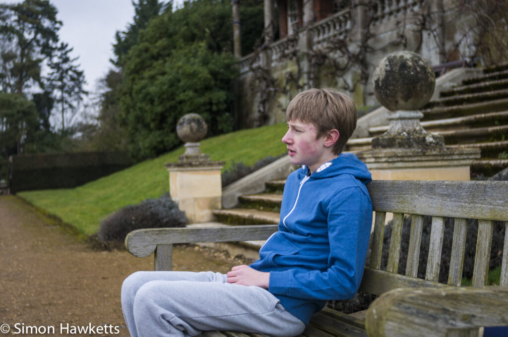 Pictures of Bennington Lordship - A boy sitting on a garden seat
