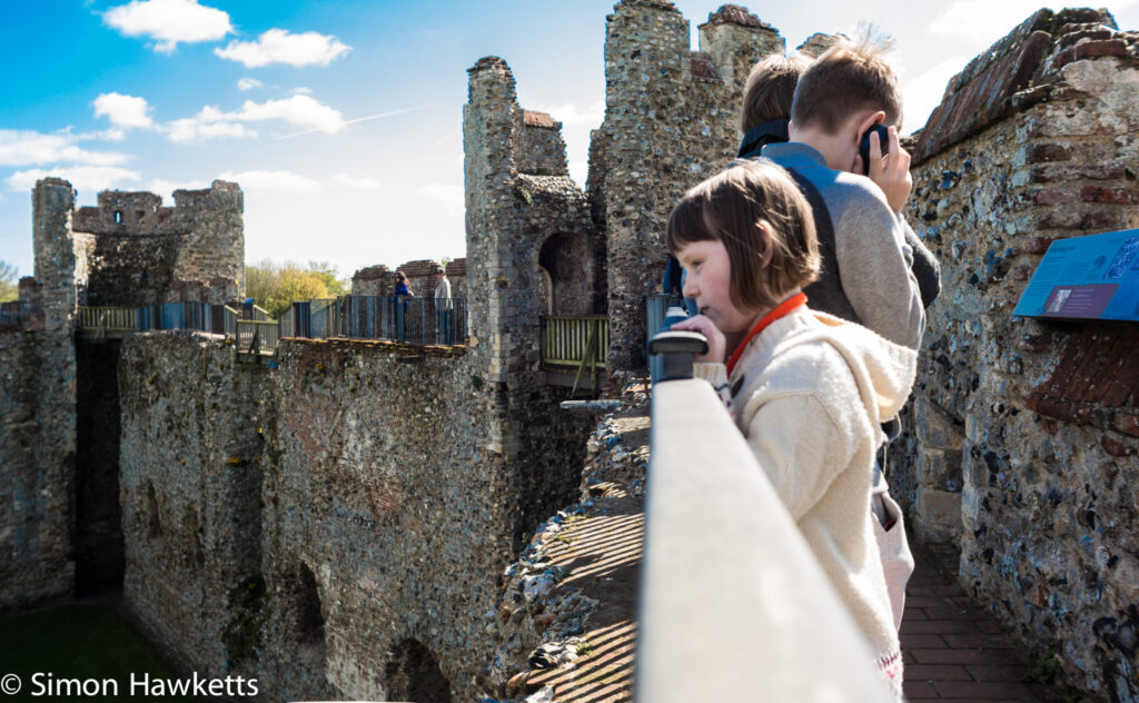Pictures of Framlingham in Suffolk - Listening to the comentary on the battlements of Framlingham Castle